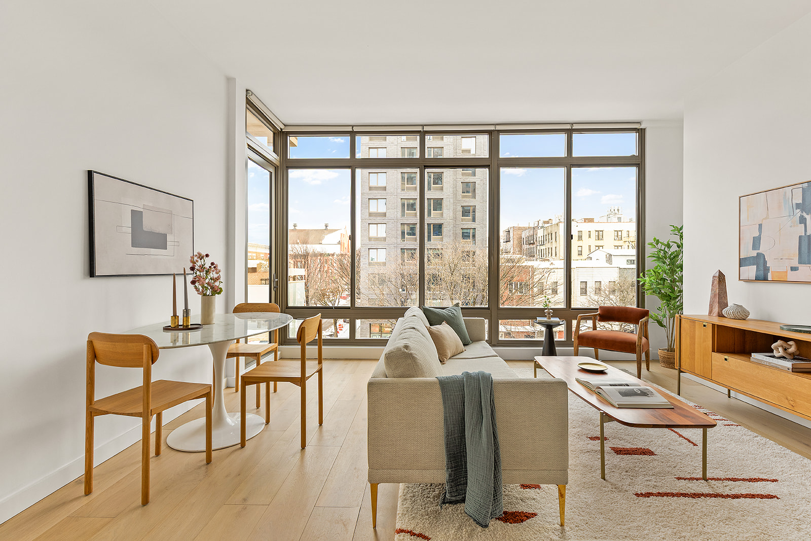 500 4th Avenue, Unit 4D Brooklyn, NY 11215 - Photo 1 of 11 a living room with furniture and floor to ceiling windows