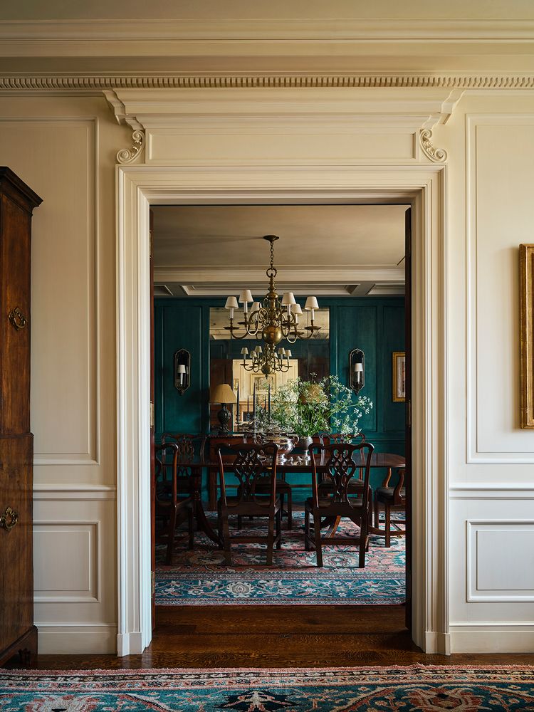 a view of a dining room with furniture wooden floor and chandelier