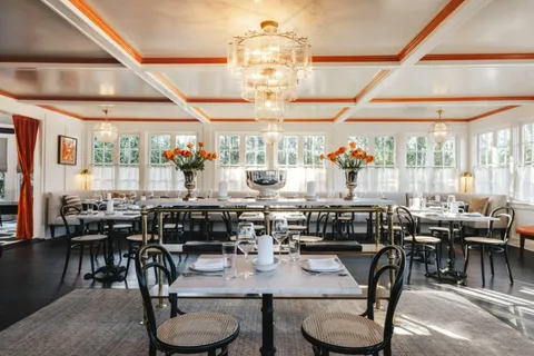 a view of a dining room with furniture window and outside view