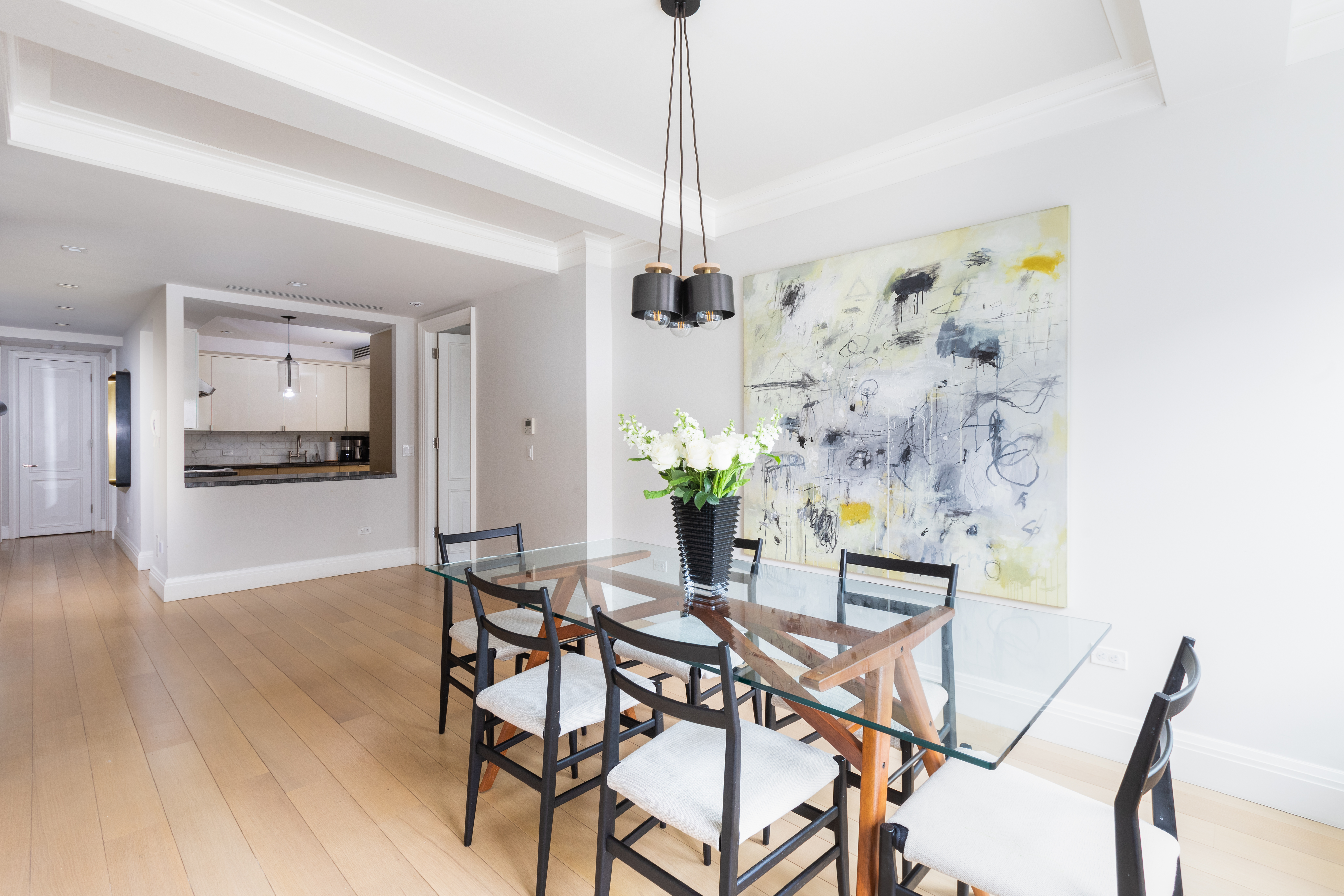141 East 88th Street, Unit 5 Manhattan, NY 10128 - Photo 3 of 12 a dining room with furniture and window