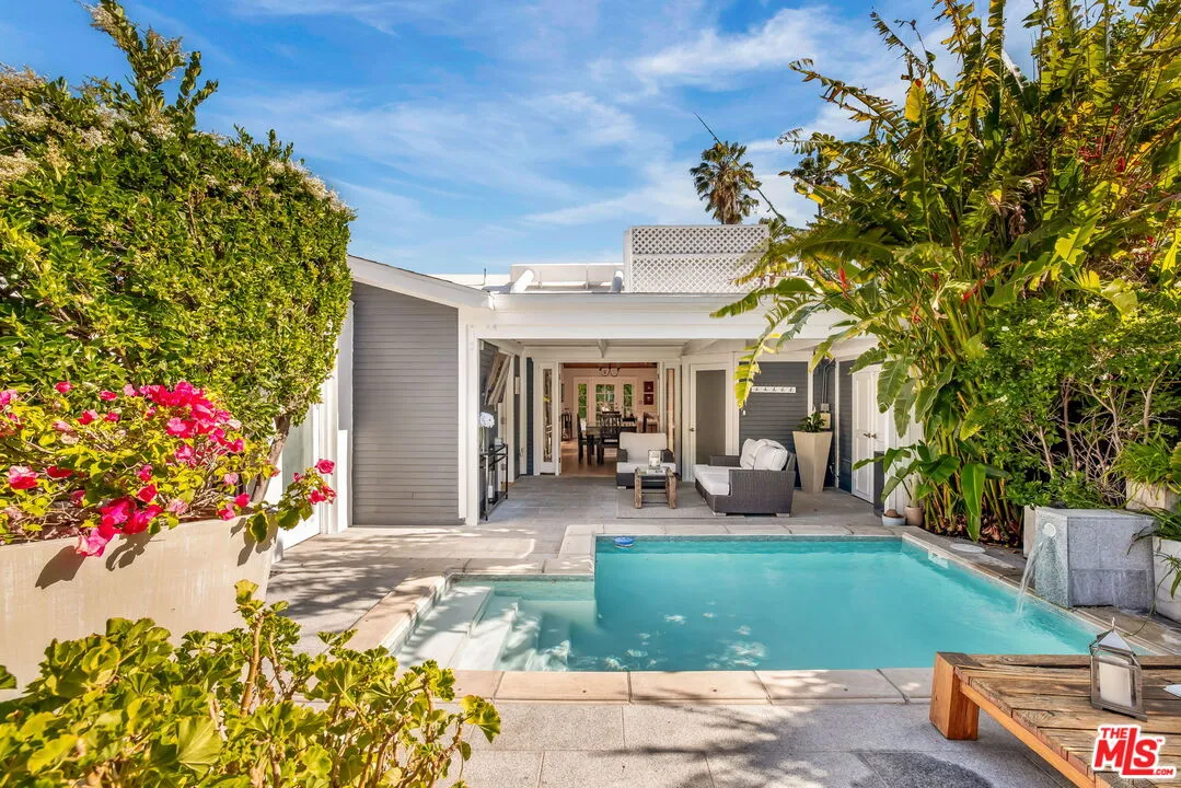a front view of a house with patio outdoor seating area and entertaining space