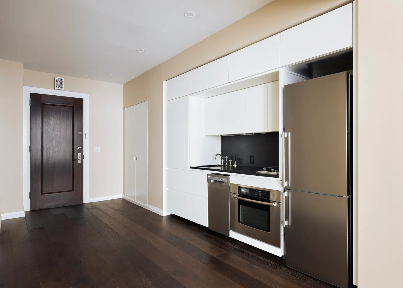 a kitchen with a stove and a microwave