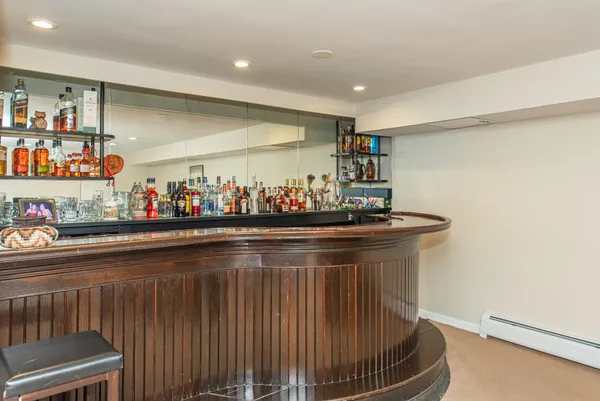 a kitchen with stainless steel appliances granite countertop a sink and a white cabinets