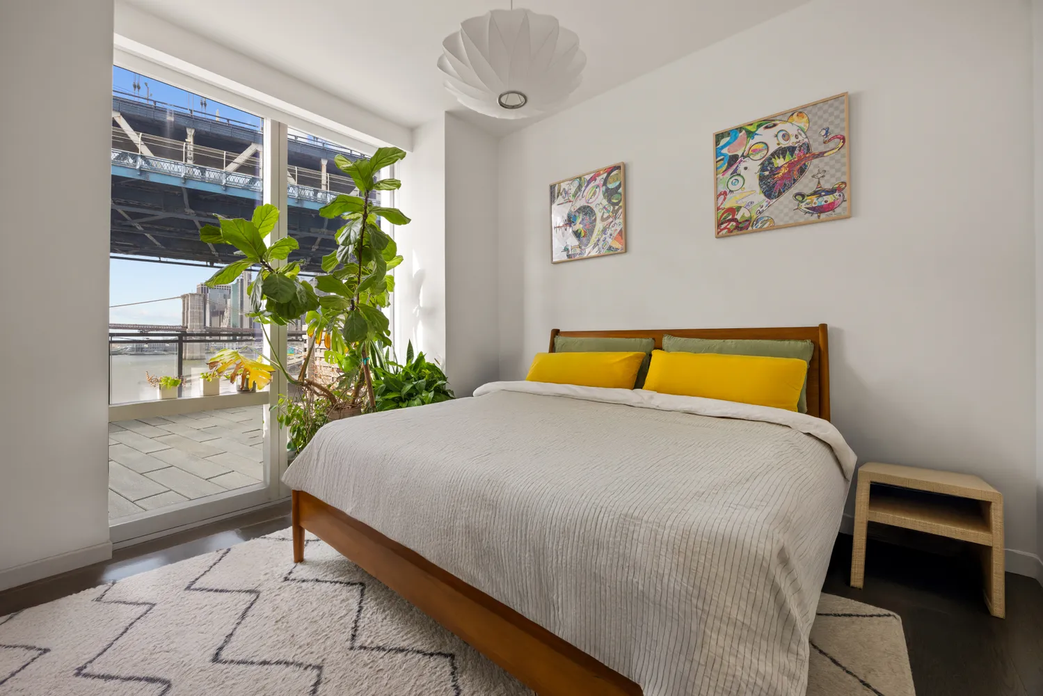 a bed sitting in a bedroom next to a window