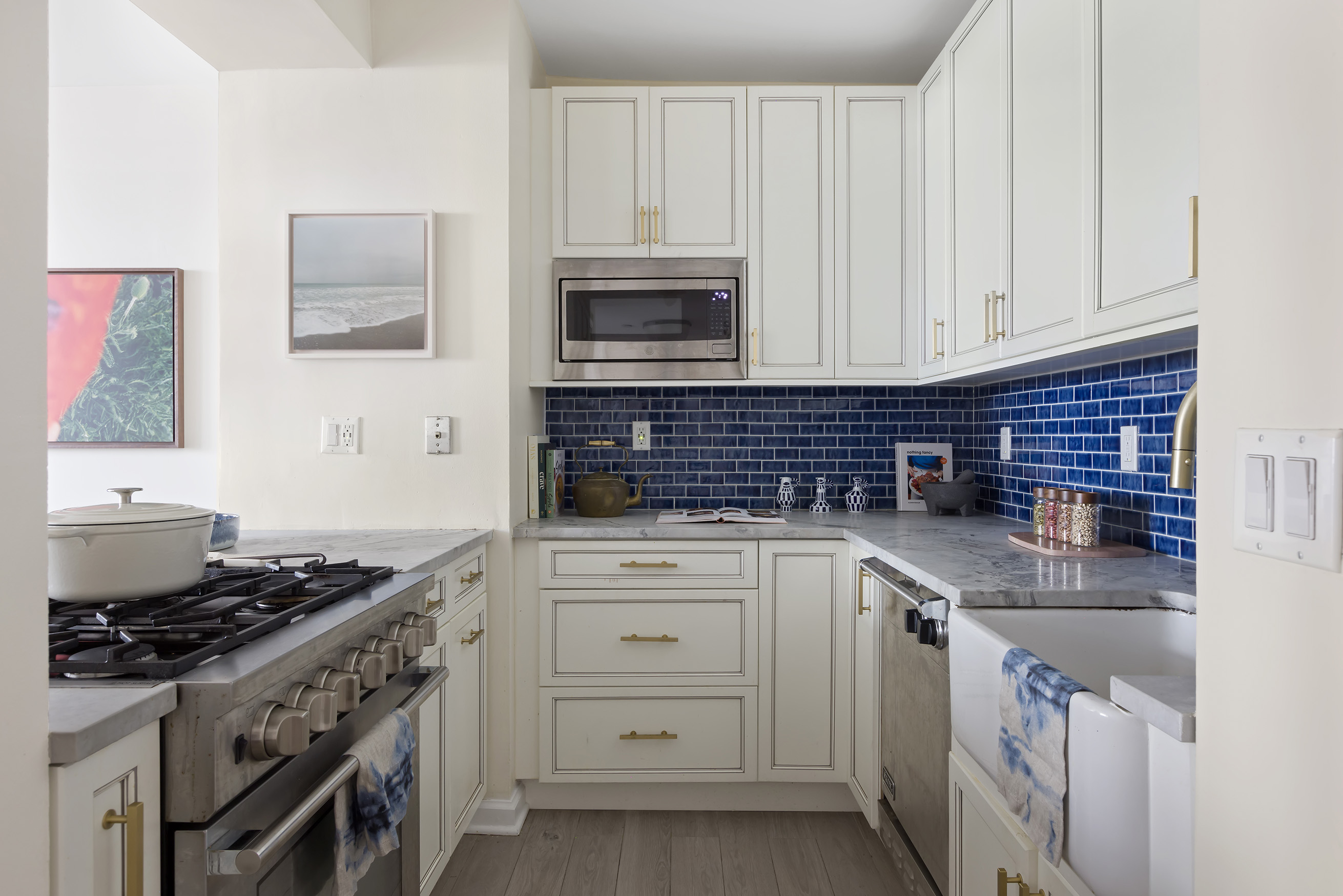 199 Bowery, Unit 3D Manhattan, NY 10002 - Photo 5 of 12 a kitchen with stainless steel appliances granite countertop a sink stove and cabinets