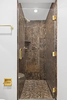 845 United Nations Plaza, Unit 56E Manhattan, NY 10017 - Photo 14 of 28 a bathroom with a shower