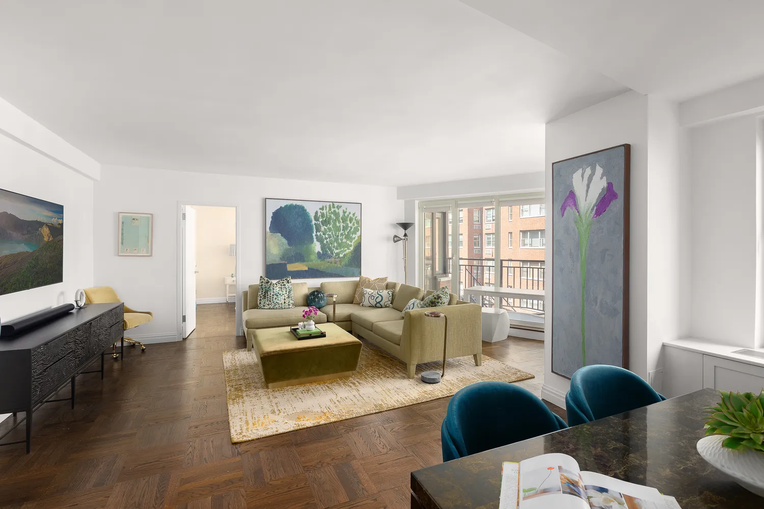 a living room with furniture and a flat screen tv