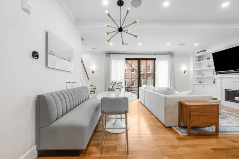 a living room with furniture fireplace and a flat screen tv