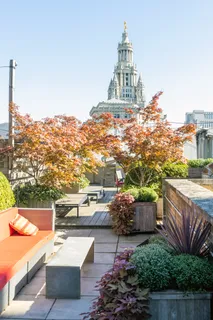 a view of roof deck with patio