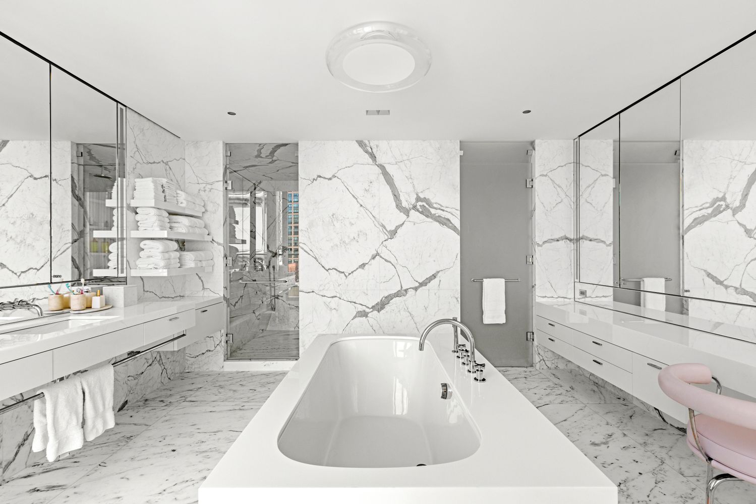 a living room with furniture and a book shelf