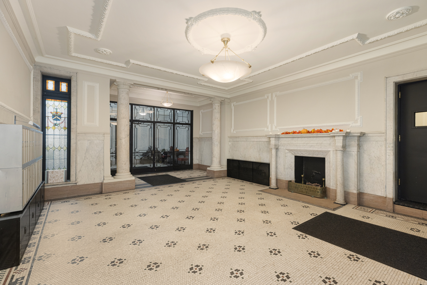 400 Riverside Drive, Unit K Manhattan, NY 10025 - Photo 9 of 22 a living room with a fireplace furniture a rug and a window