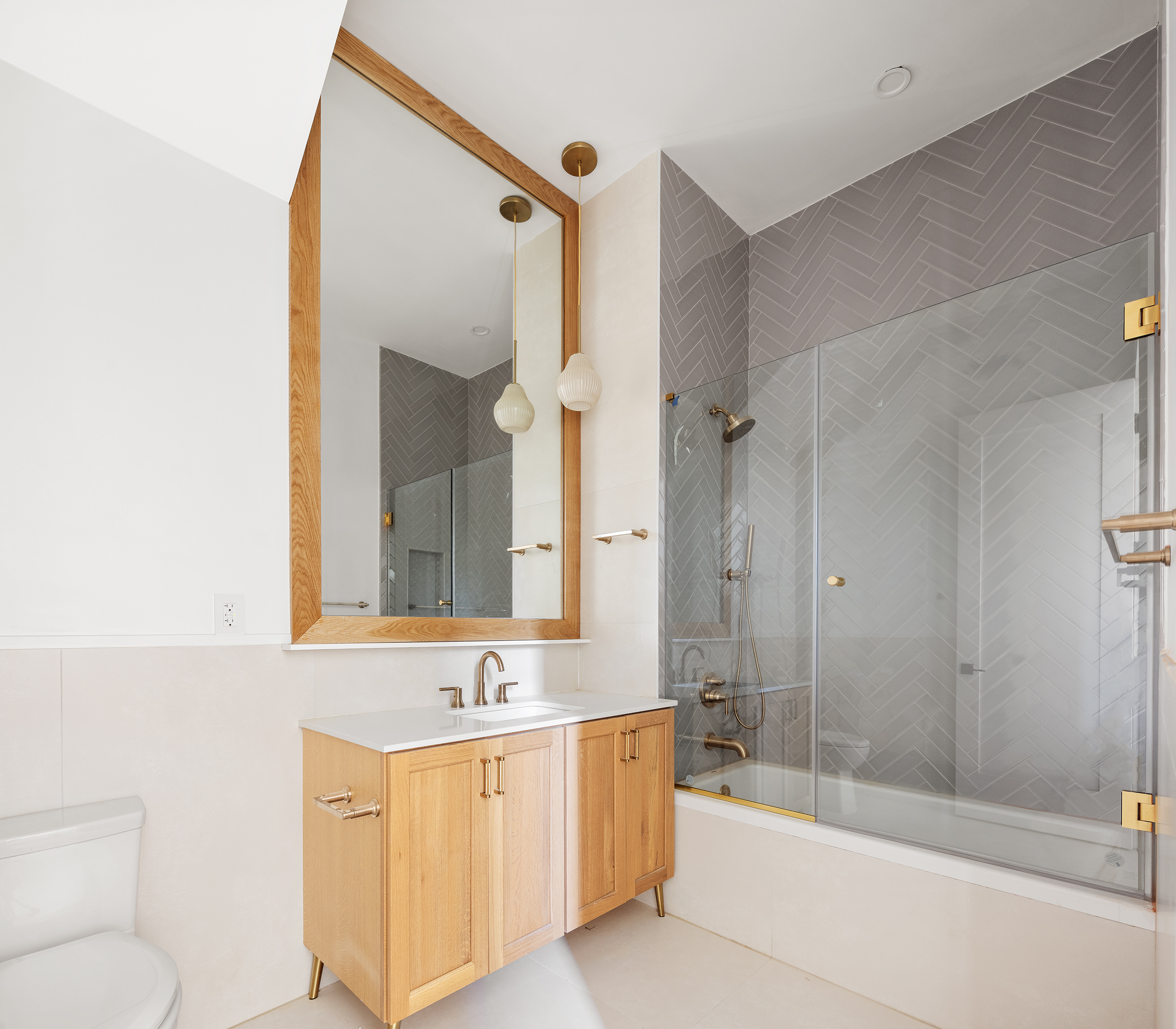 262 17th Street, Unit GARDEN Brooklyn, NY 11215 - Photo 5 of 8 a bathroom with a bathtub shower sink mirror and toilet