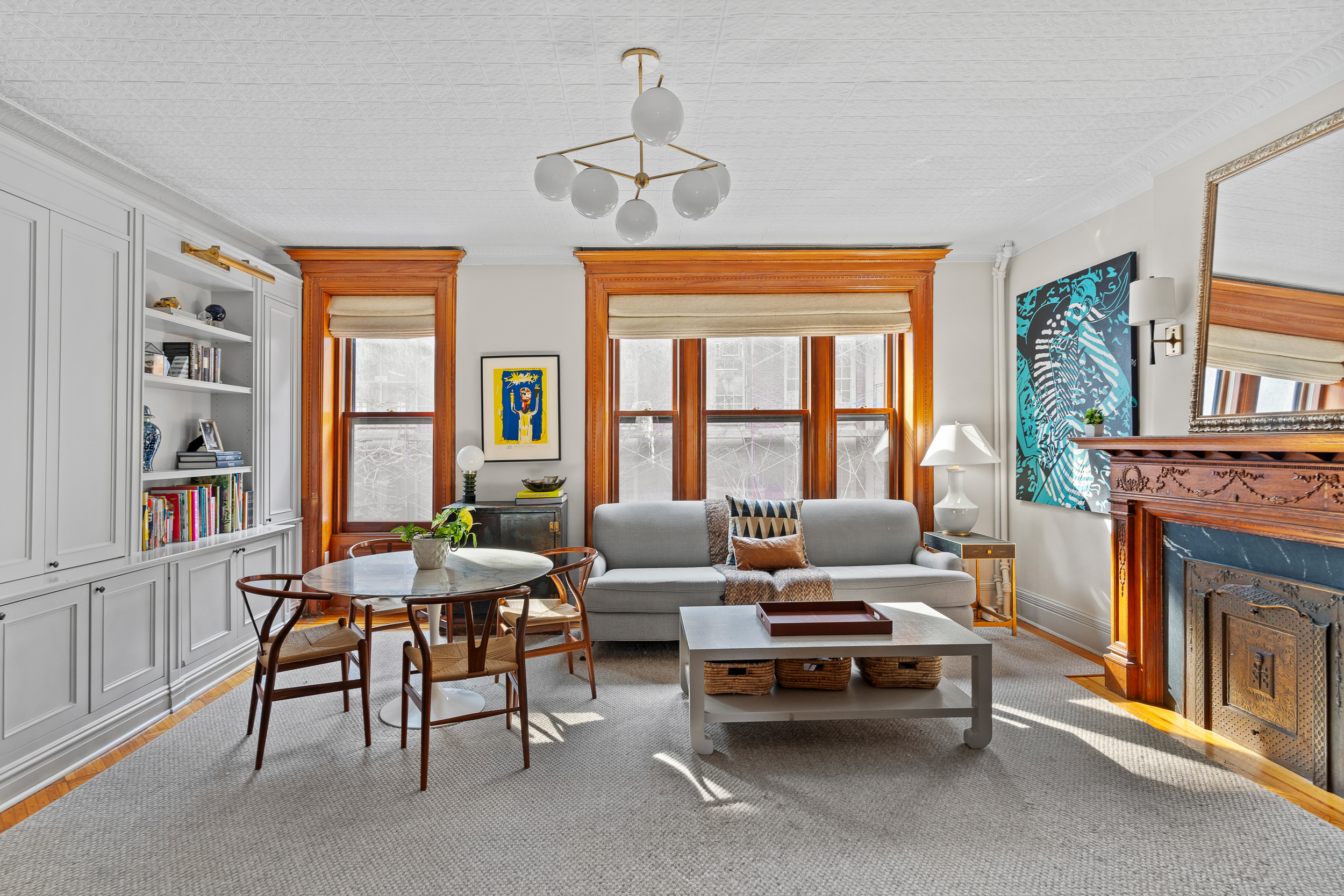 479 4th Street, Unit TRIPLEX Brooklyn, NY 11215 - Photo 8 of 17 a living room with furniture and a fireplace
