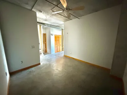 a view of a terrace with lawn chairs