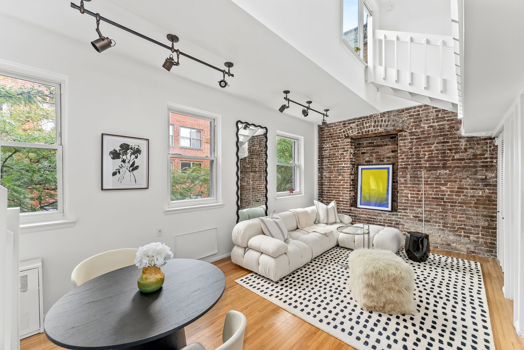 207 East 21st Street, Unit 6E Manhattan, NY 10010 - Photo 3 of 12 a living room with furniture and a fireplace