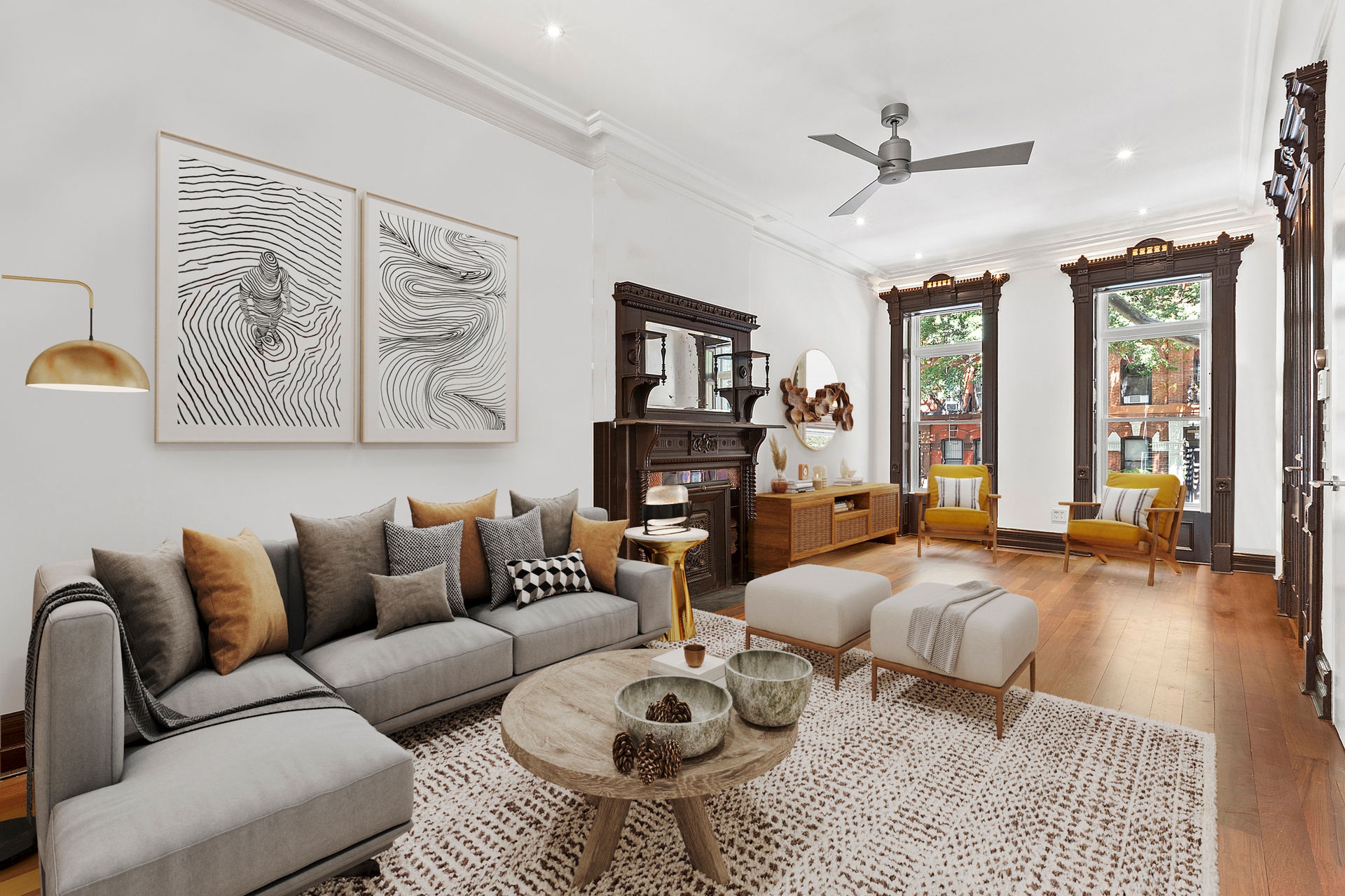 a living room with furniture ceiling fan and a rug