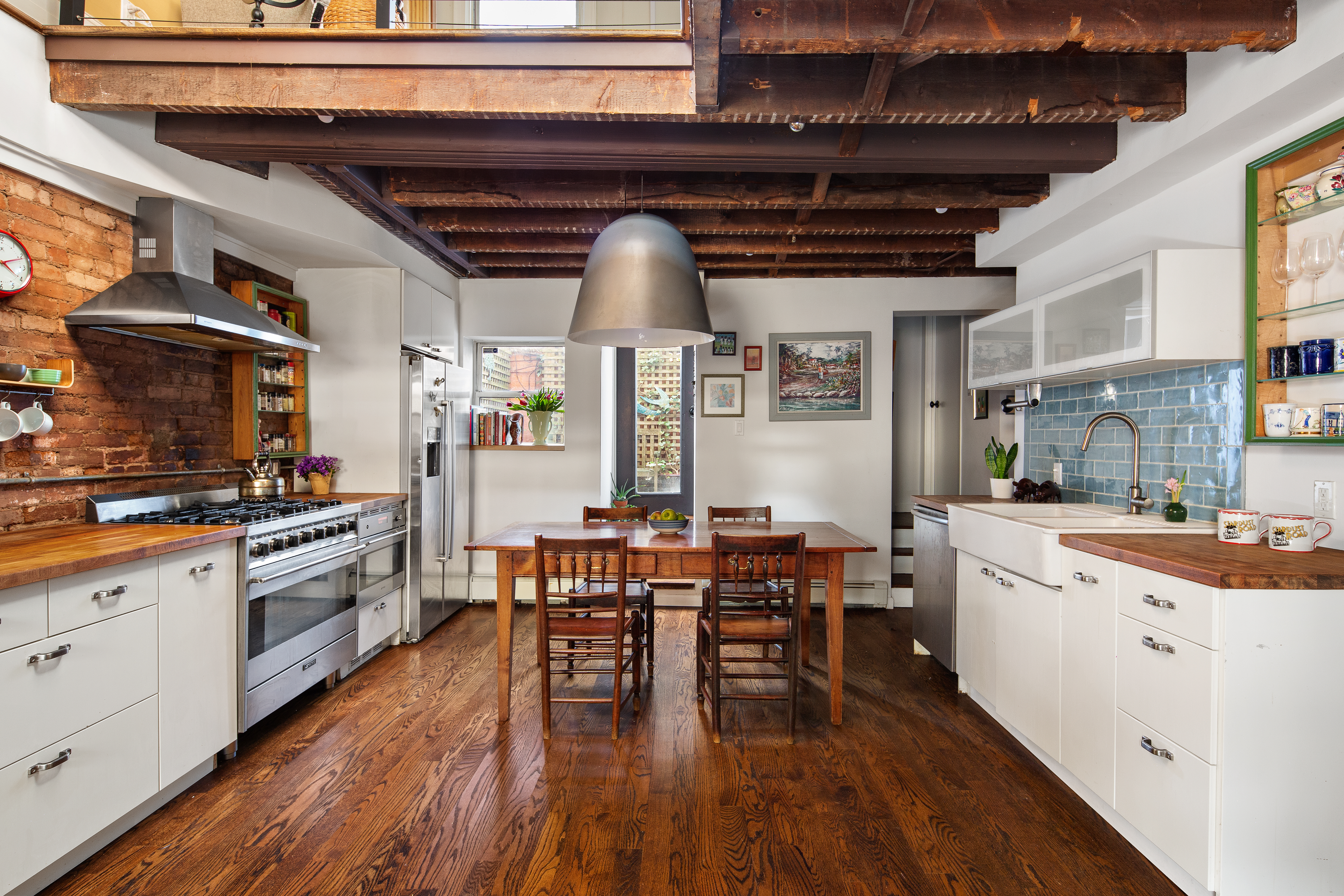 11 Sylvan Terrace Manhattan, NY 10032 - Photo 5 of 16 a open kitchen with stainless steel appliances granite countertop a stove and wooden cabinets