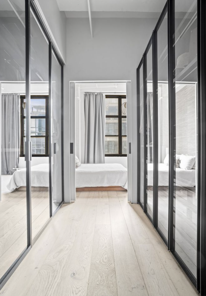 448 West 37th Street, Unit 8C Manhattan, NY 10018 - Photo 7 of 10 a view of an entryway with a glass door