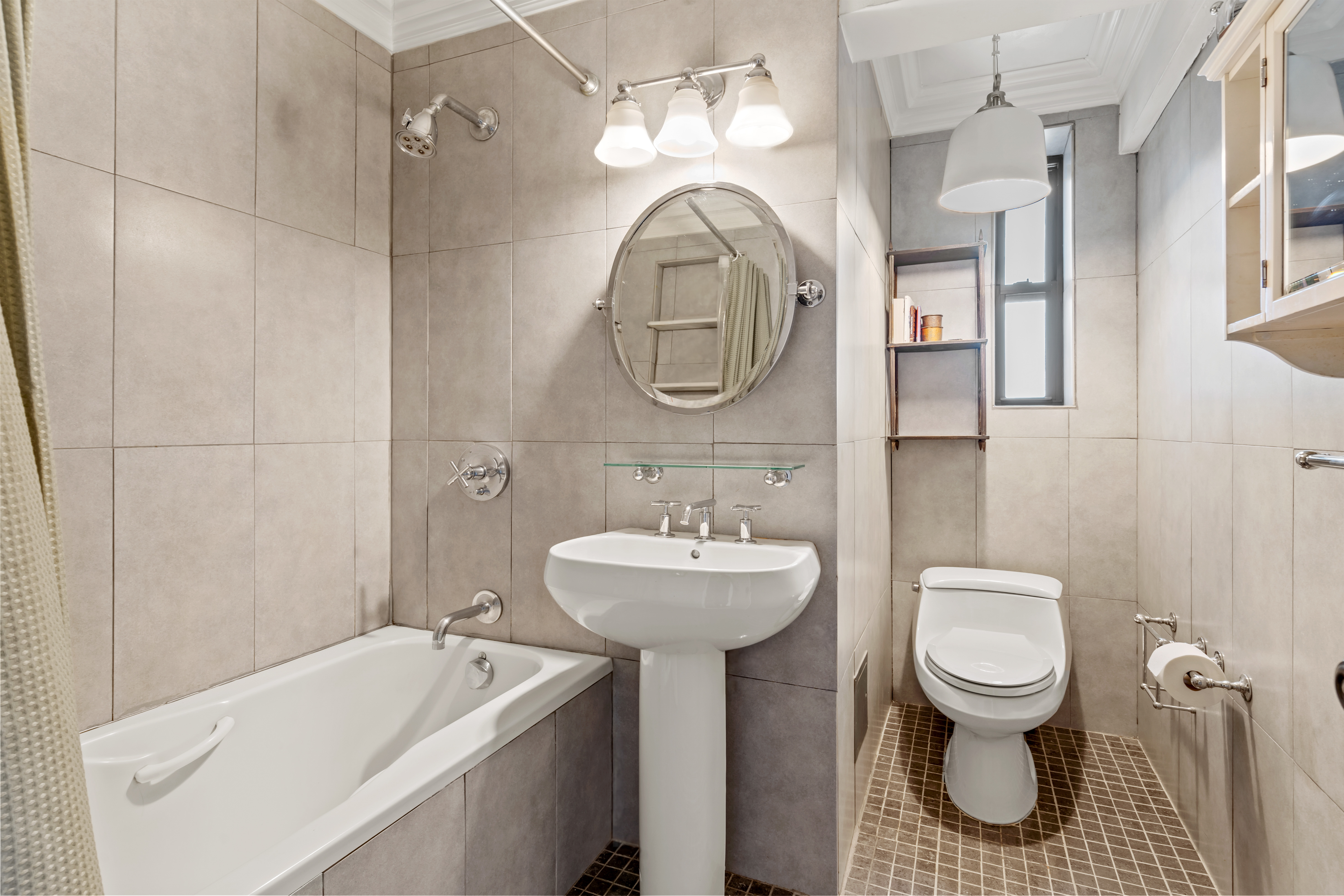 48-21 40th Street, Unit 1B Queens, NY 11104 - Photo 7 of 9 a bathroom with a toilet sink and mirror