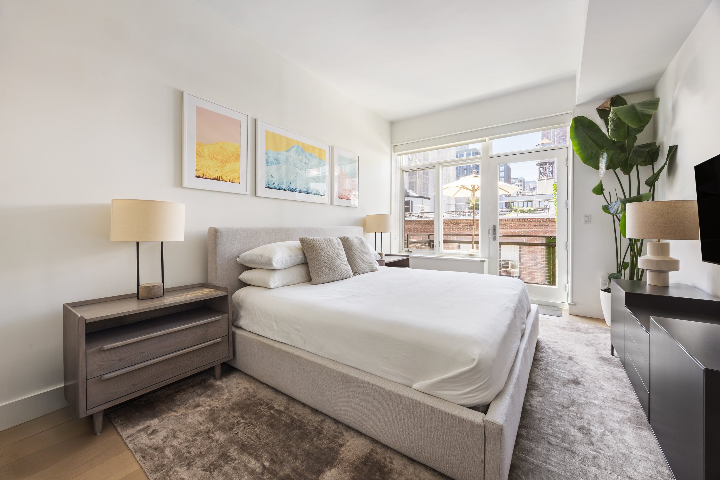 51 Walker Street, Unit 8B Manhattan, NY 10013 - Photo 8 of 15 a bed room with a bed and a night stand