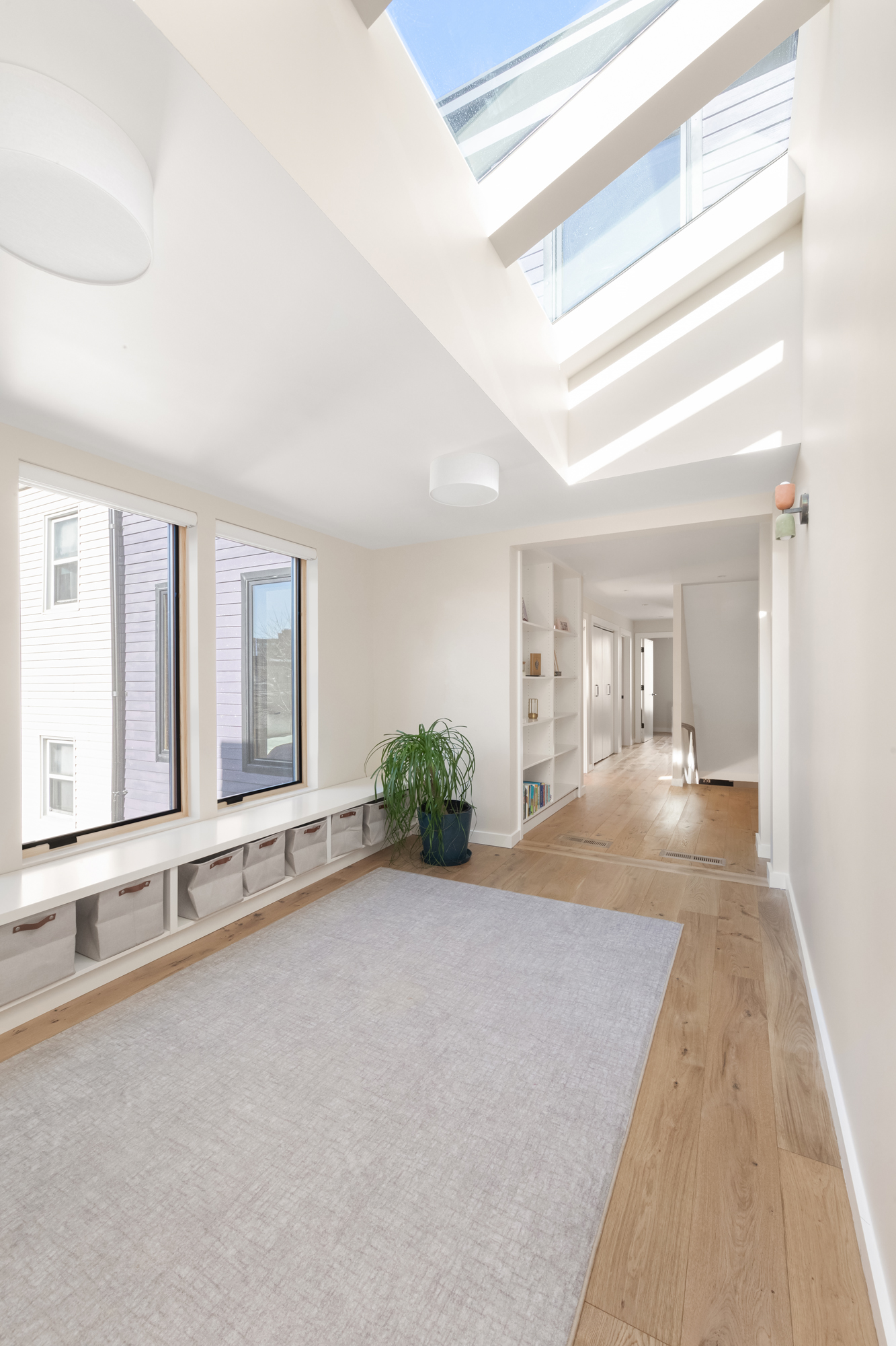 683 Leonard Street Brooklyn, NY 11222 - Photo 12 of 25 a view of an empty room with wooden floor and a window