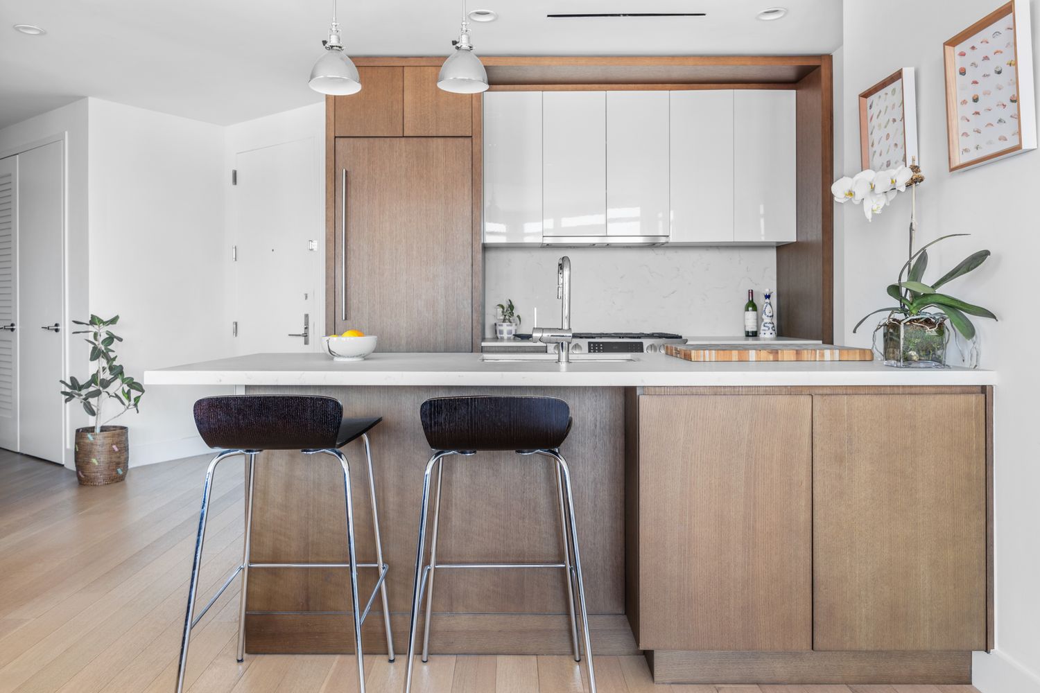 a kitchen with a sink cabinets and window