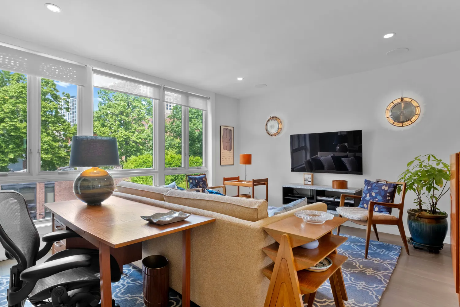 a living room with furniture and a flat screen tv