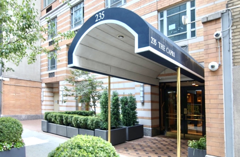 235 East 55th Street, Unit 44B Manhattan, NY 10022 - Photo 10 of 12 a view of a entrance gate of the building