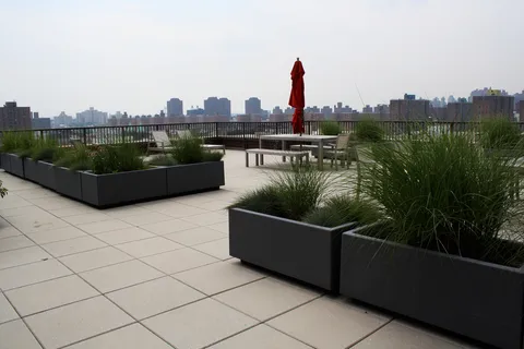 a view of a terrace with sitting area