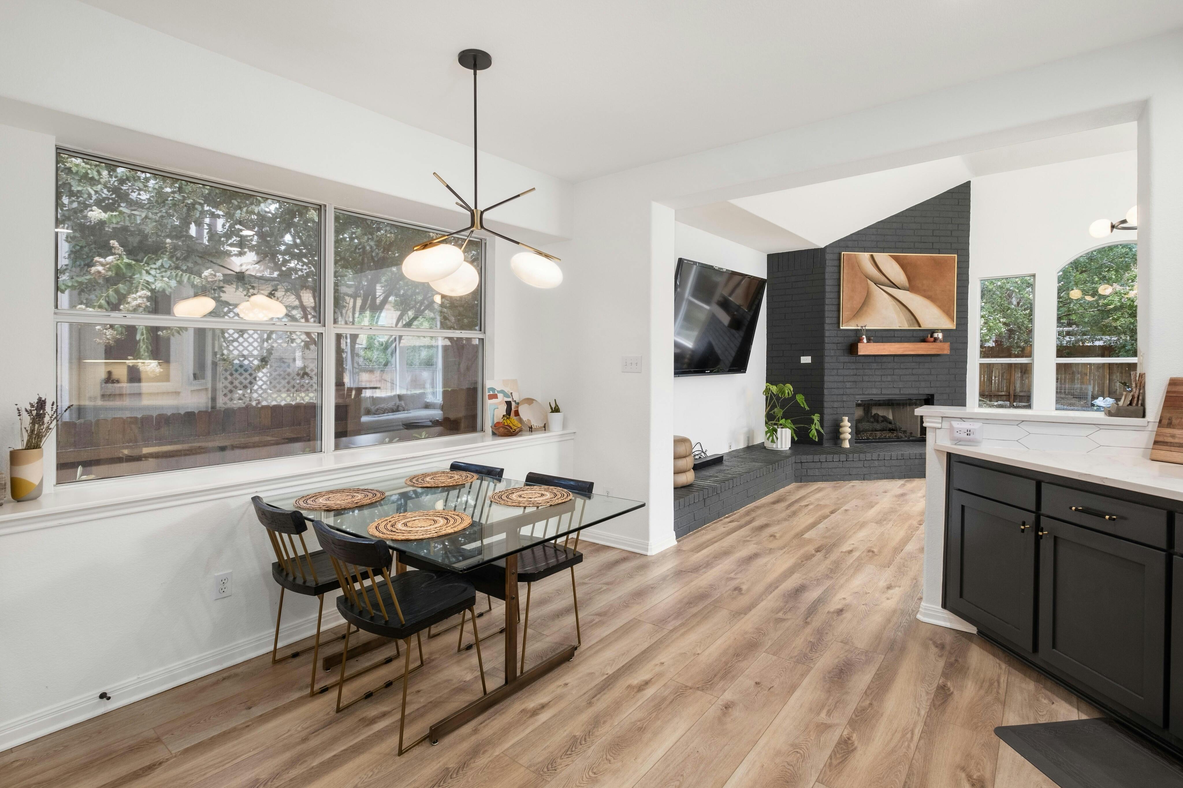 10608 Pointe View Drive Austin, TX 78738 - Photo 15 of 46 a living room with furniture a flat screen tv and a large window