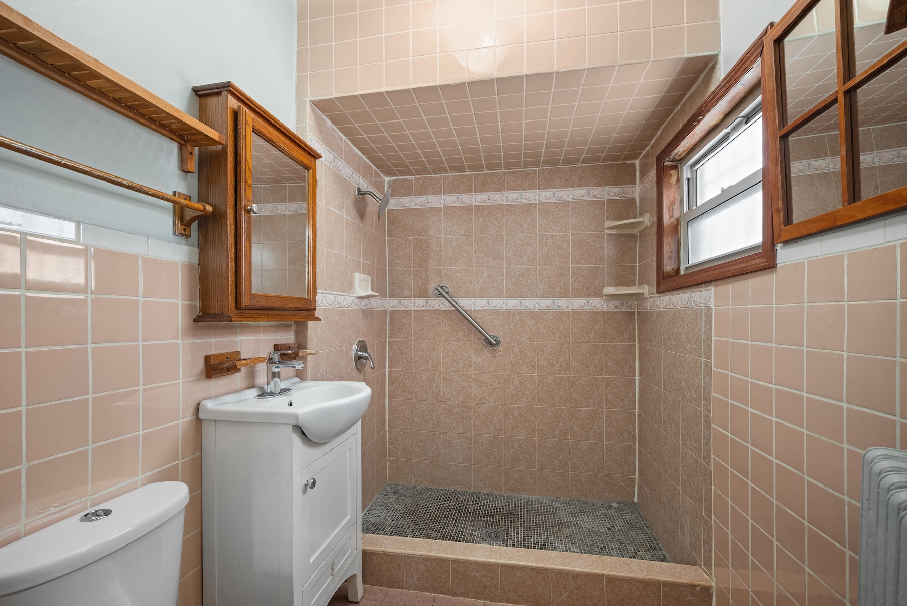 396 19th Street Brooklyn, NY 11215 - Photo 8 of 17 a bathroom with a sink a toilet and shower