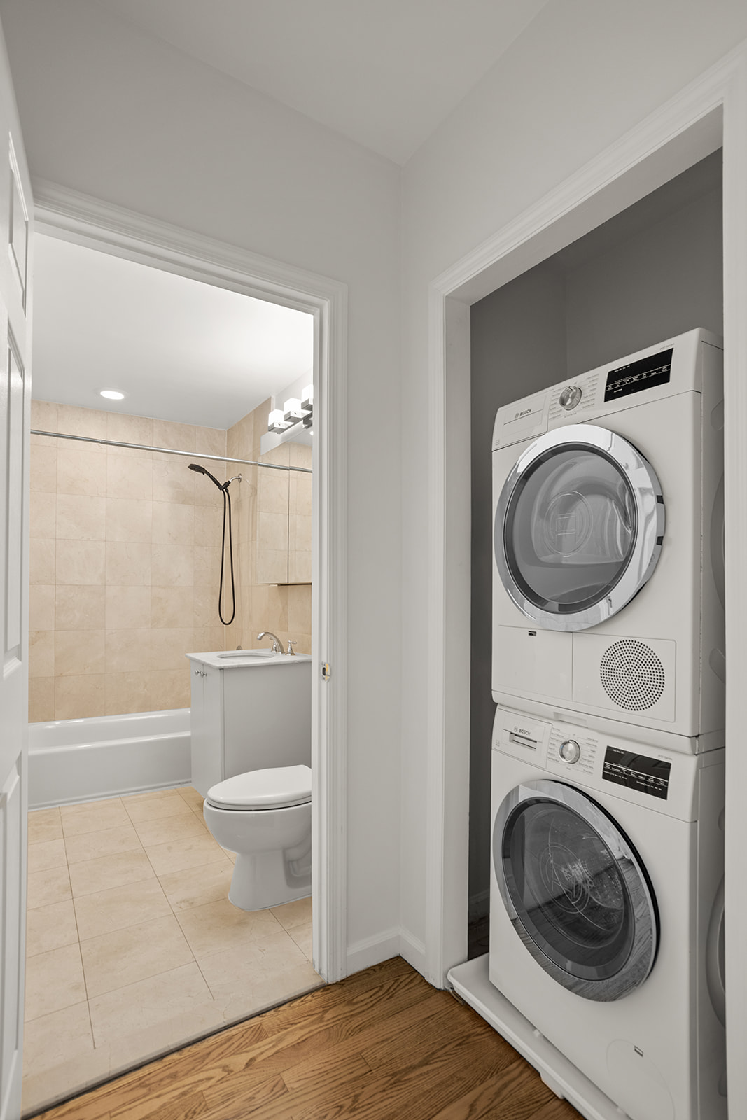 702 Ocean Parkway, Unit 5R Brooklyn, NY 11230 - Photo 12 of 13 a view of a bathroom with washing machine and toilet