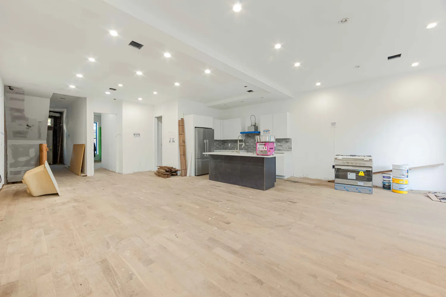 a view of a kitchen with a stove and a refrigerator