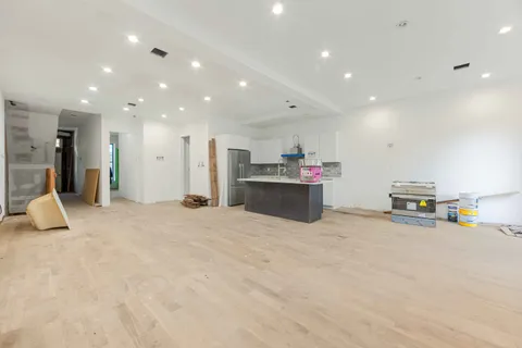 a view of a kitchen with a stove and a refrigerator