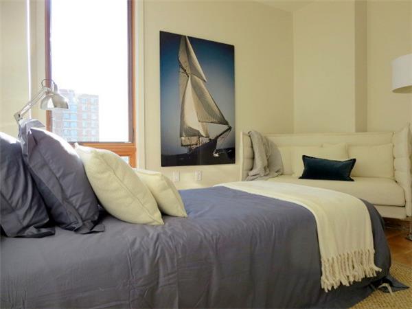 548 4th Avenue, Unit 8A Brooklyn, NY 11215 - Photo 16 of 21 a bedroom with a bed and a painting on the wall