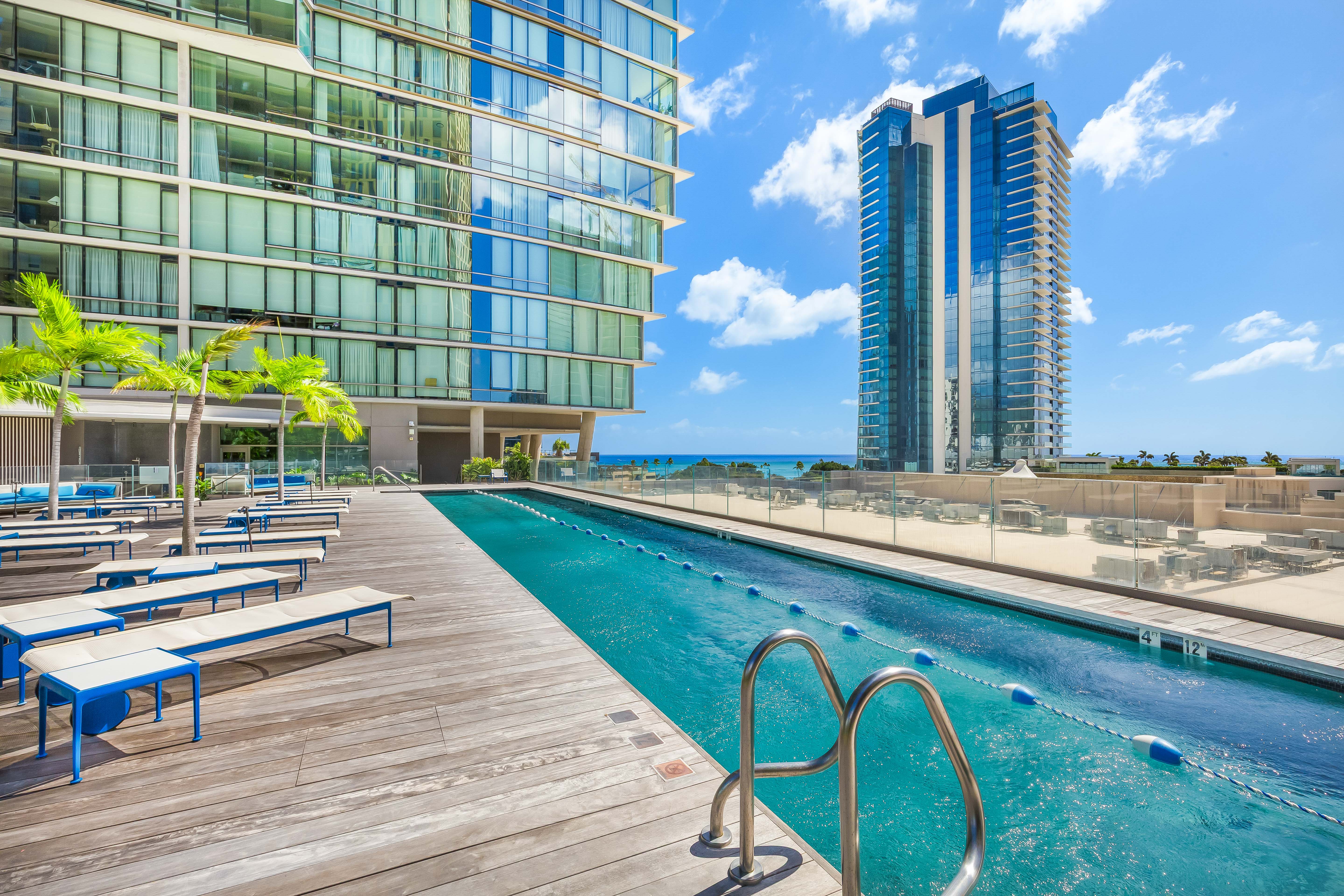 1001 Queen Street Honolulu, HI 96814 - Photo 18 of 29 a swimming pool with outdoor seating and yard