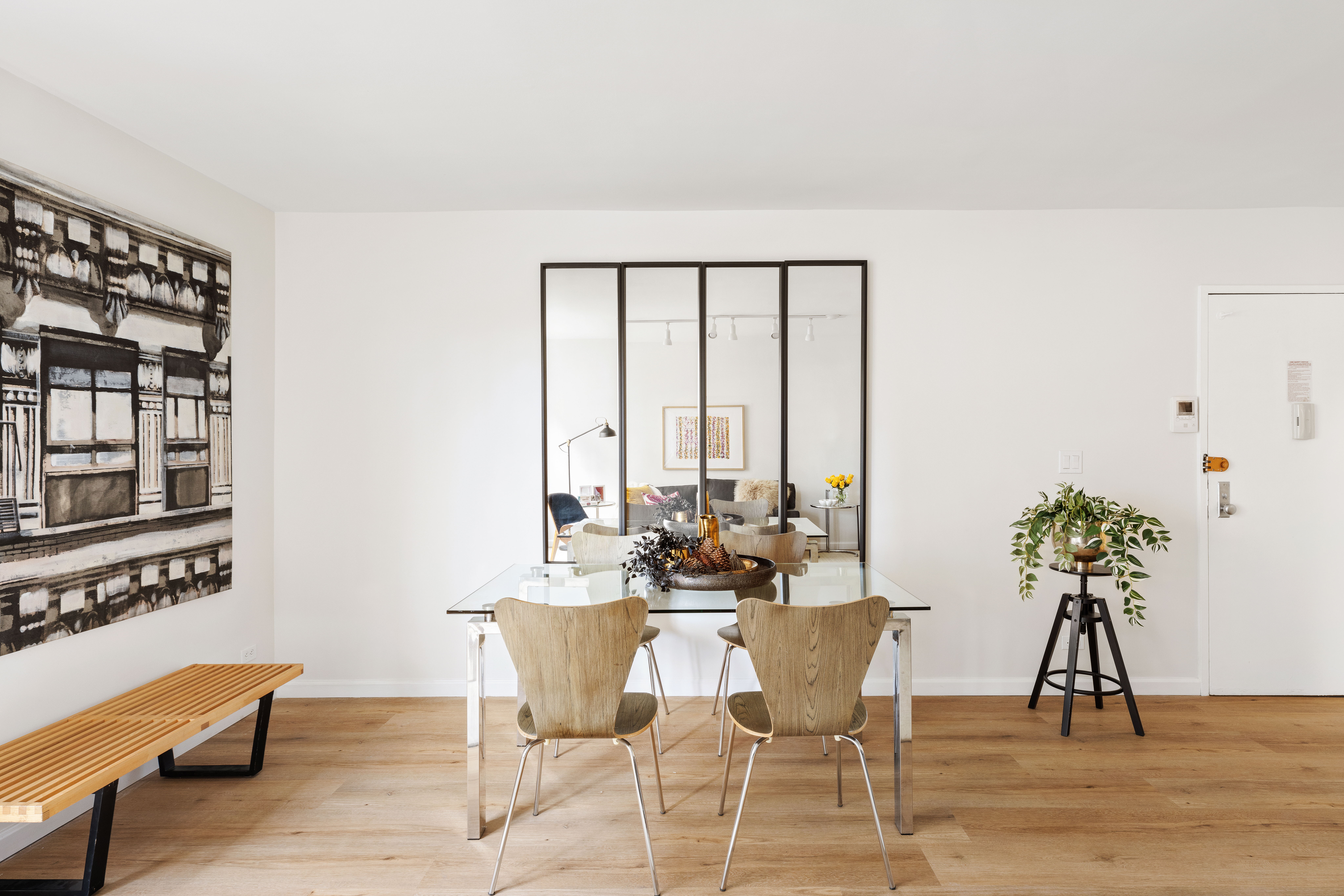141 Barrow Street, Unit 1B Manhattan, NY 10014 - Photo 2 of 10 a dining room with furniture and wooden floor