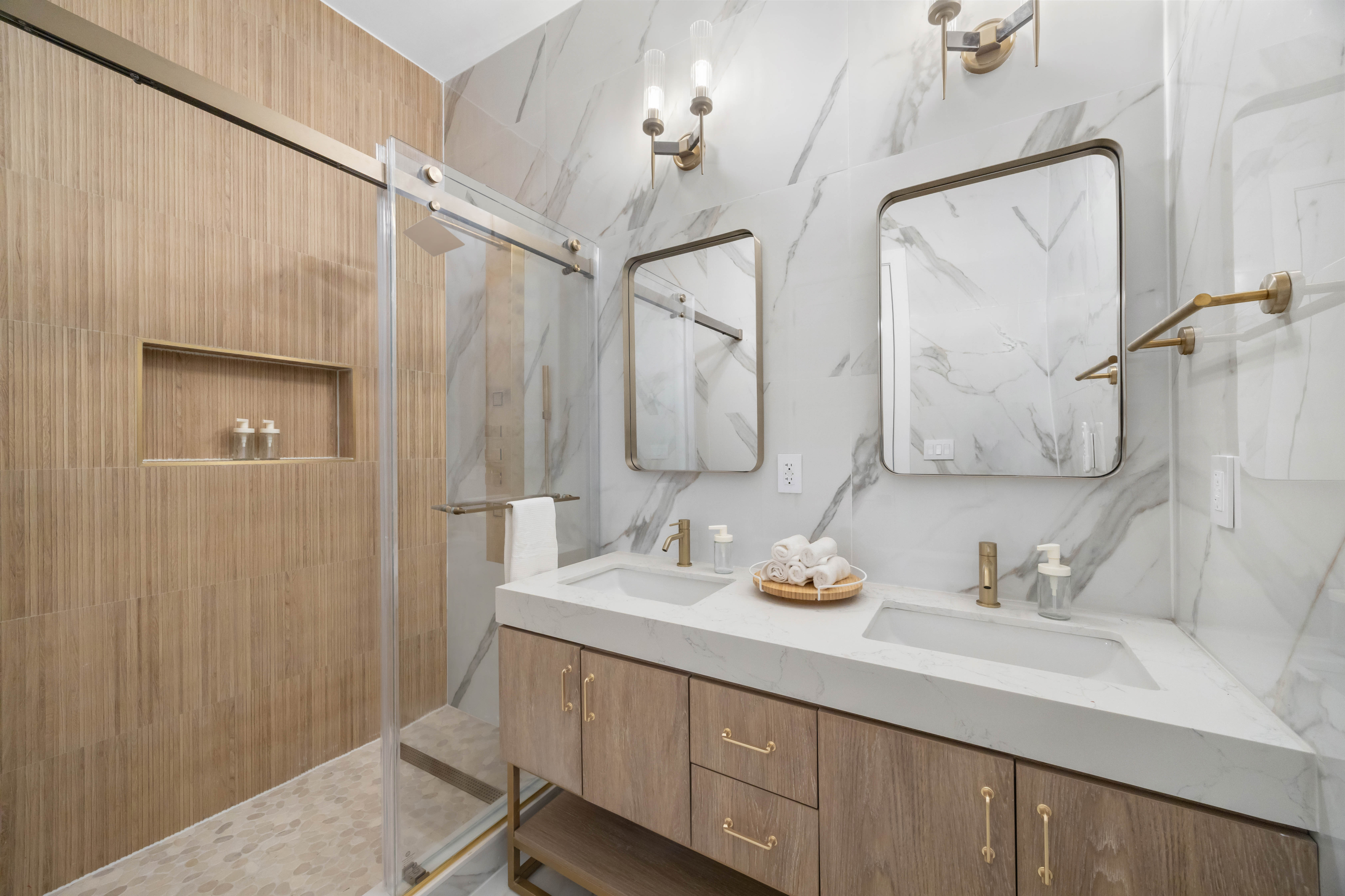 1000 Putnam Avenue Brooklyn, NY 11221 - Photo 4 of 18 a bathroom with a double vanity sink and a mirror