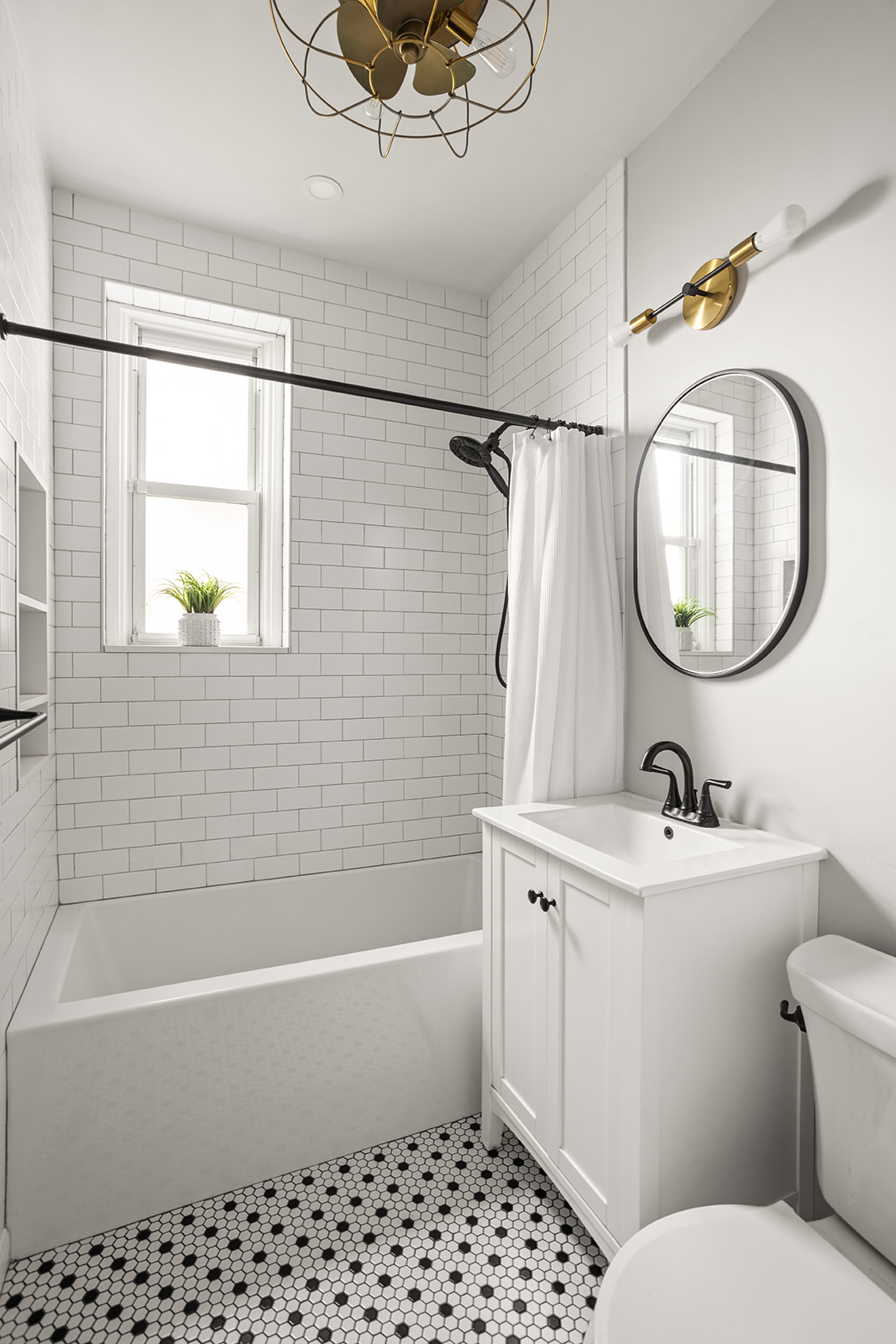 72-17 34th Avenue, Unit 1P Queens, NY 11372 - Photo 8 of 14 a bathroom with a sink toilet and shower