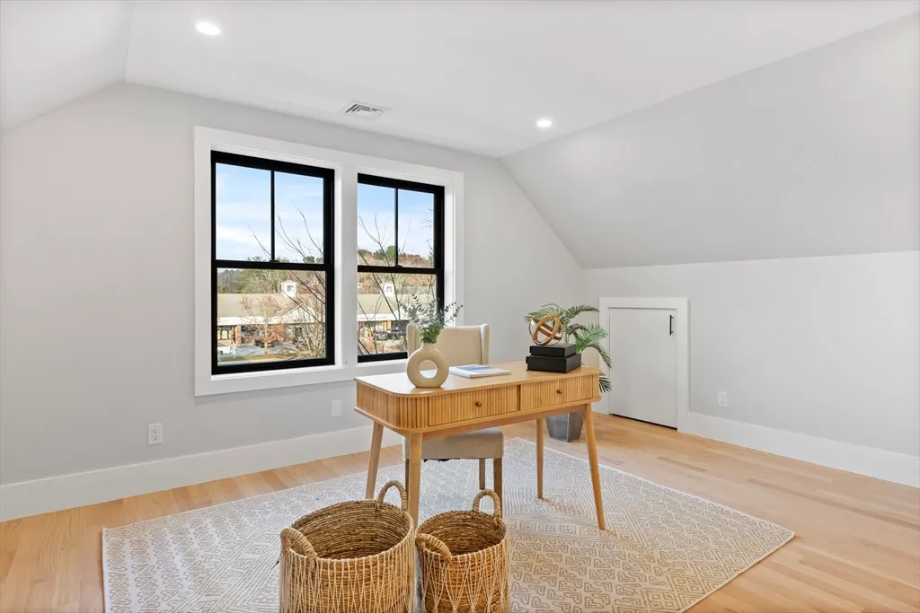 a workspace with furniture and window