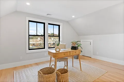 a workspace with furniture and window