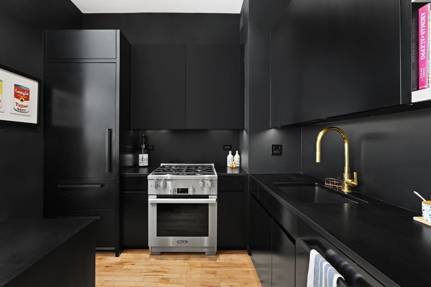 a kitchen with granite countertop a stove and a refrigerator