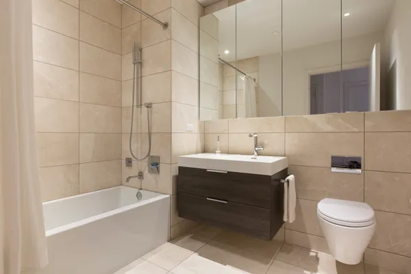a bathroom with a sink a toilet and bathtub