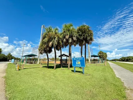 a view of a park with swings and slides