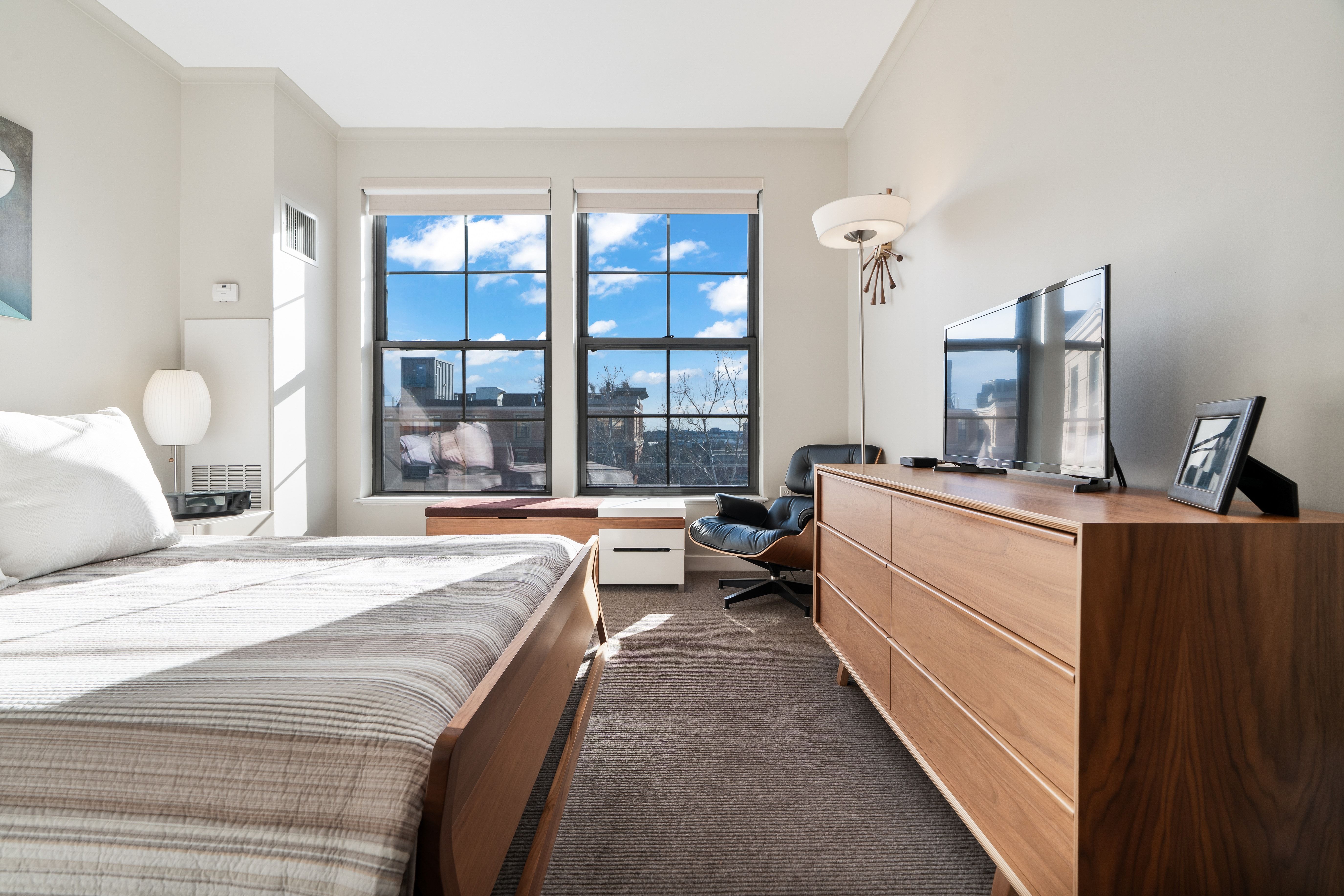 2 Rollins Street, Unit D601 Boston, MA 02118 - Photo 19 of 29 a room with bed mirror and window