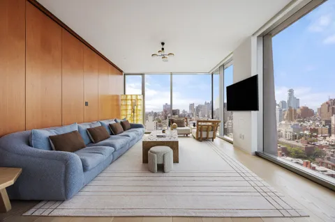 a living room with furniture fireplace and a flat screen tv