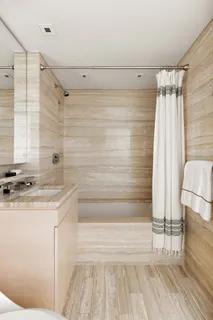 a bathroom with a sink and a shower