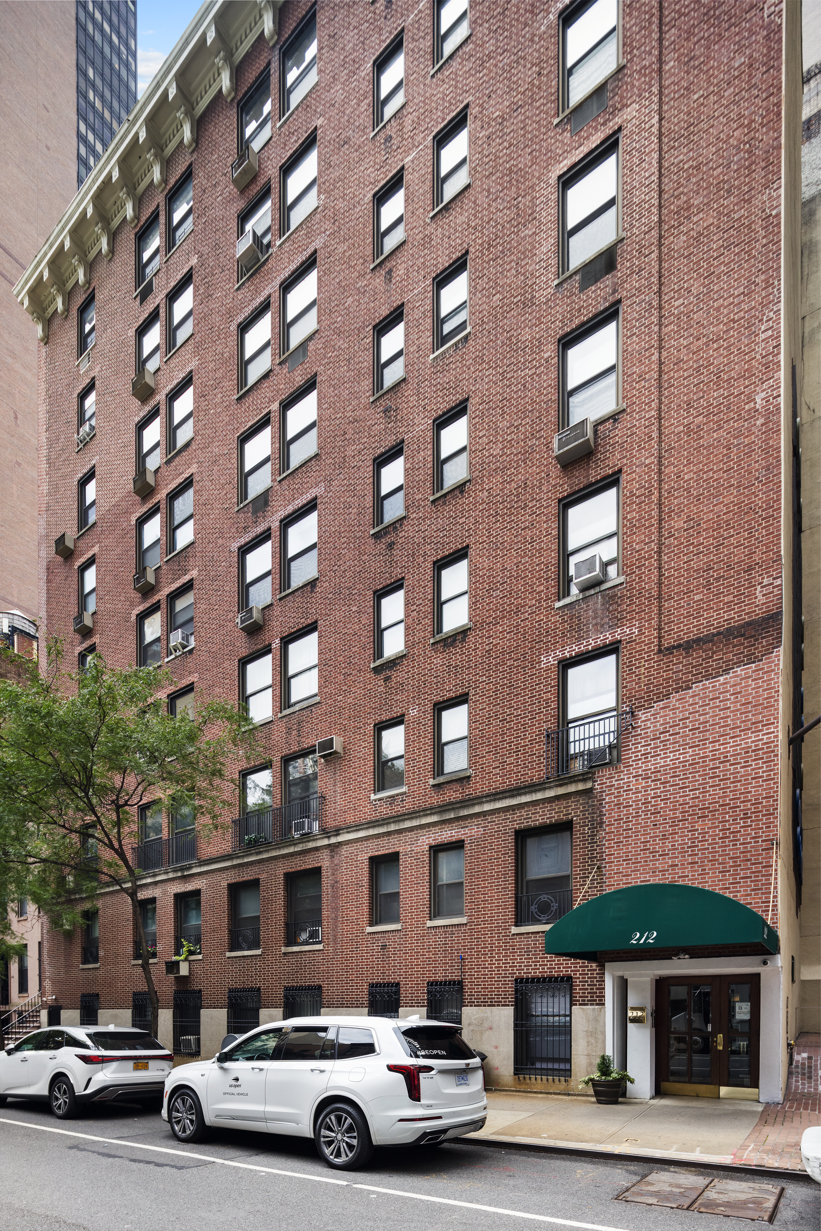 212 East 48th Street, Unit 8E Manhattan, NY 10017 - Photo 13 of 14 a car parked in front of a building