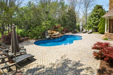 a view of a backyard with sitting area