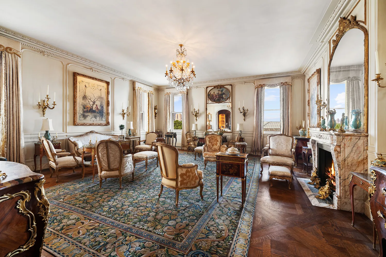 a living room with patio furniture and a large window